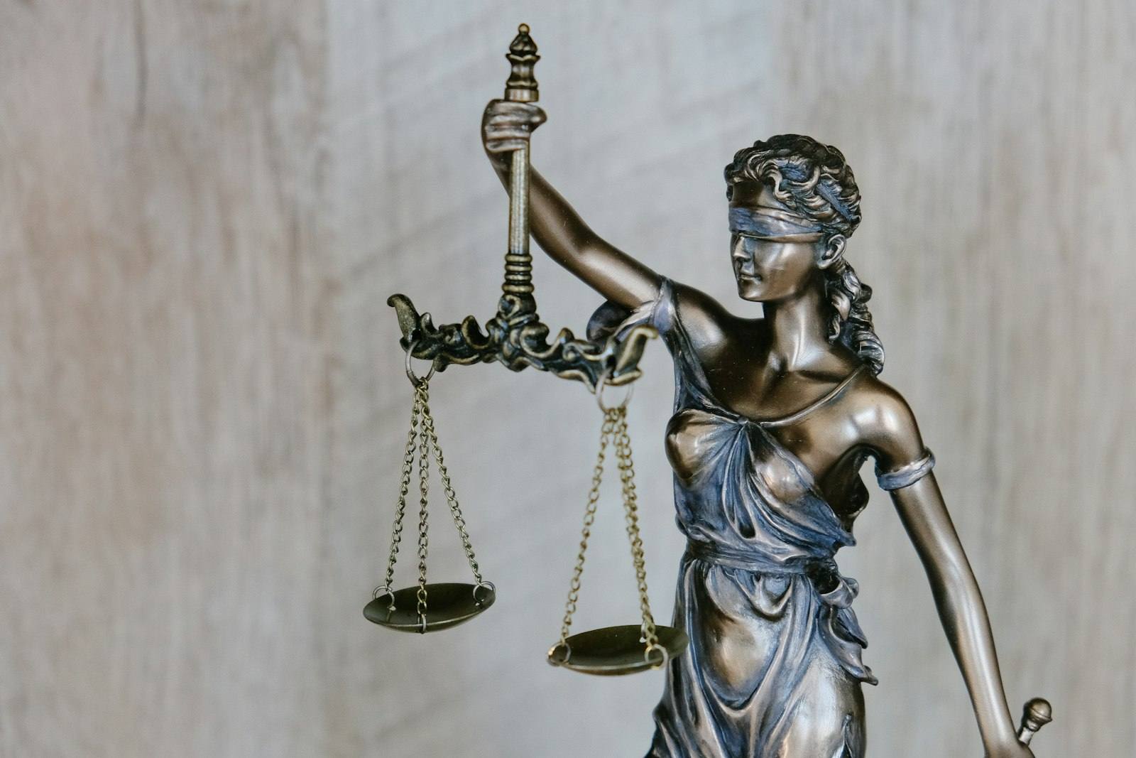 Scales of justice statue in a law office